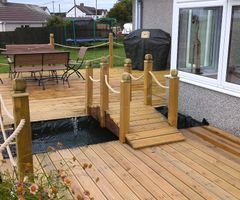 Decking with pond and bridge fitted